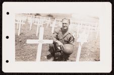 US Army medical corpsman kneeling in the Camp Gusen cemetery